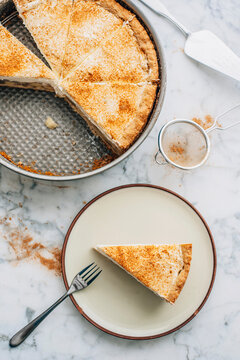 Apple wine tart with cream and cinnamon