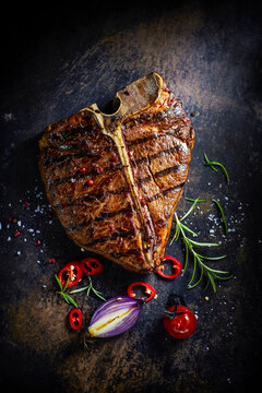 T-Bone-Steak, chili, onion, cherry tomato and rosemary