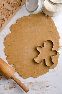 Gingerbread dough with gingerbread man cookie cutter