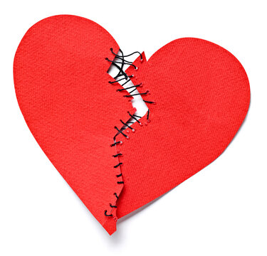 Broken heart tied up with thread
