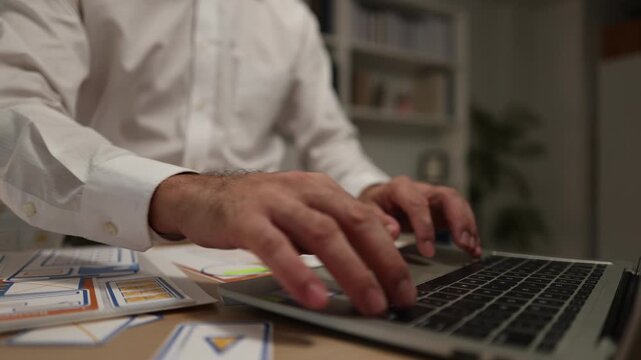 Business professional reviewing mobile application wireframes and user interface layouts while planning digital product development, UX design strategy, software features, and workflow optimization.