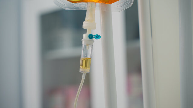 Yellow solution dripping in a hospital drip