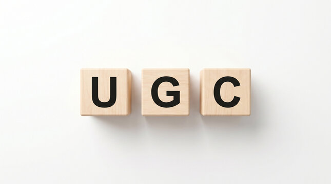 UGC University Grants Commission wooden letter blocks top view for higher education regulation and academic development concept