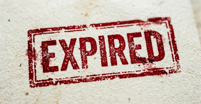 A weathered red rectangular stamp with the word "EXPIRED" printed boldly inside it is stamped onto a textured off-white paper surface.