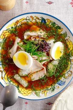 Traditional okroshka soup with egg and chicken