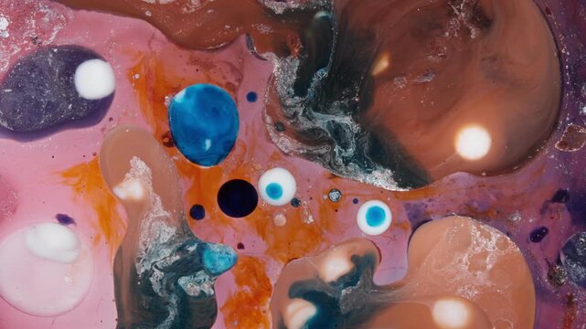 Macro view of ink and oil mixtures forming organic, cell-like structures. This artistic representation of chemical reactions features cinematic fluid movement and relaxation vibes.