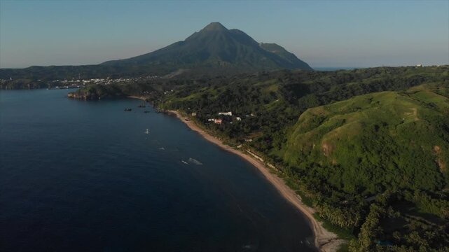 Drone shot of Batanes Island, Philippines, showcasing scenic coastal landscapes, rolling hills, and the natural beauty of the island from above.