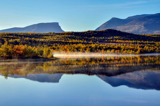 Sunrise lake in autumn. Abisko national park in north of Sweden.