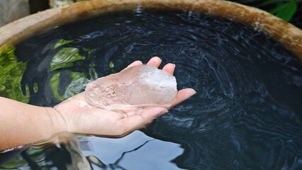 Fototapeta premium Adding alum to water for removes the suspended clay particles from water.
