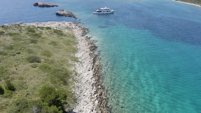Boat floating in Kornati National Park in Croatia during sunny weather