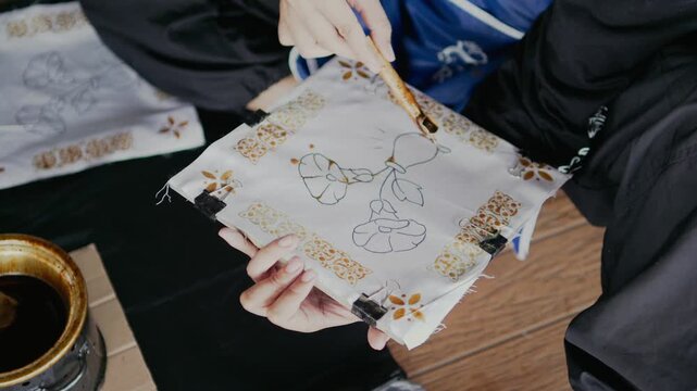 making a batik with hand drawn traditional process with canting