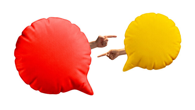 Red and yellow speech bubble cushions with pointing hands in argument scene. Concept of customer complaint, online debate, communication conflict and feedback dispute.