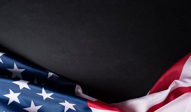 Happy Independence Day. American flags  against a black background. July 4.