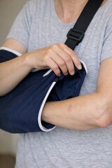 Naklejka premium A person with a cast on their arm, sitting or standing in various scenarios