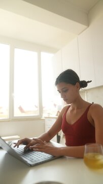 Woman focused on enhancing images and captions for social outlets