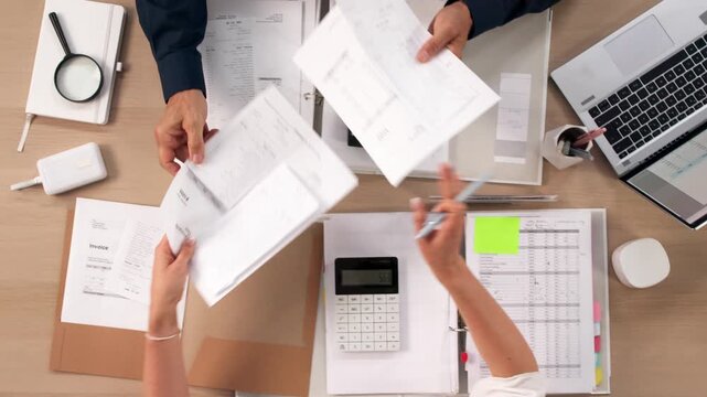 Financial Analyst Carefully Reviewing Documents During Merger Due Diligence