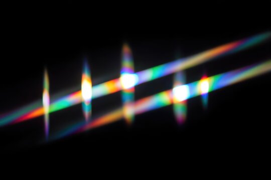 Abstract image of colorful light diffraction with a black background.