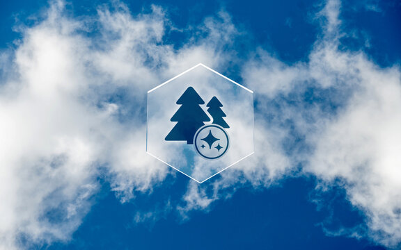 Conceptual icon of forest nature symbol with sparkling AI star emblem on glass honeycomb overlay against cloudy blue sky background