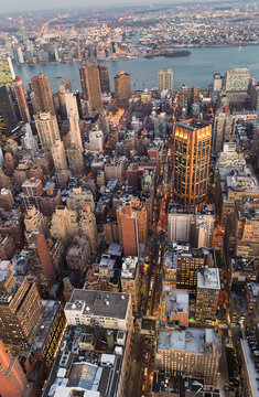 Aerial View of Midtown Manhattan Cityscape Looking East Toward River at Dusk