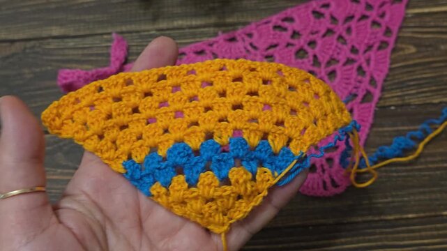 Knitting patterns with a raised pattern and yarn in different colors. Knitted texture. Space for text.