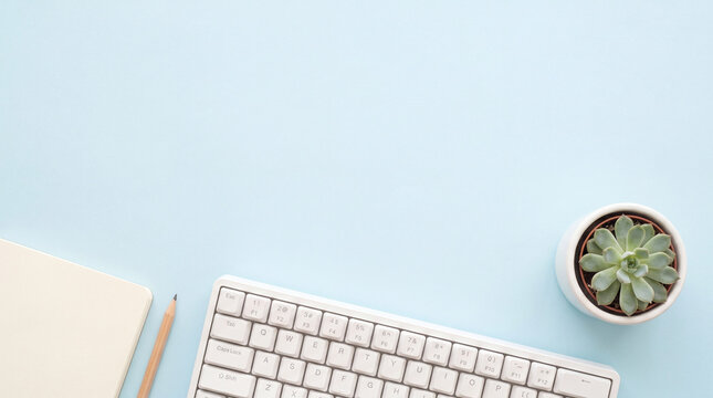 Serene Pastel Blue Workspace for Focused Study and Writing