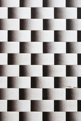 Obraz premium Black and white checkered facade background