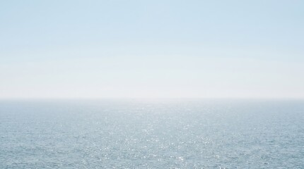 Fototapeta premium Ocean water background with calm blue sea surface and sun light reflection