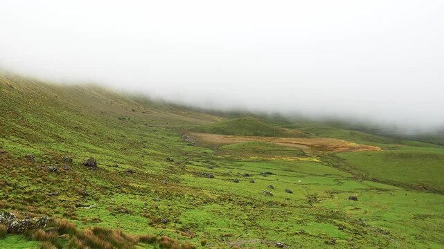 Panoramic view of the caldera on a foggy morning at Corvo Island, Azores archipelago in Portugal.
