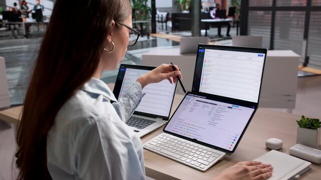 Quality Manager Reviewing Software Dashboard For Corrective Actions