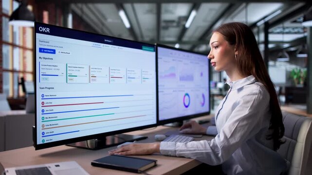 Project Manager Reviews Team Progress Using OKR Dashboard