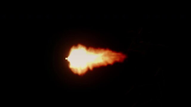 Muzzle flash from a gun firing in super slow motion isolated on a black background.