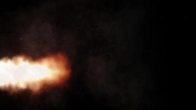 Intense burst of fire from a flamethrower erupting across a black background.