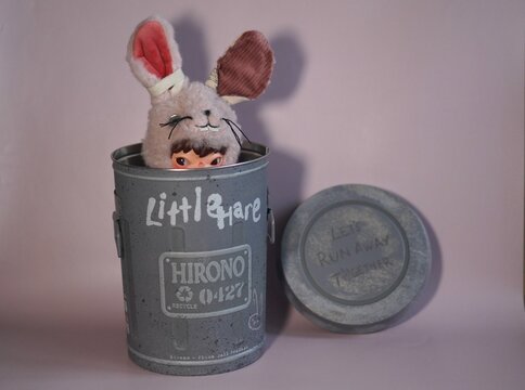 Turkey, May 27, 2026: Hirono plush figure in a pink plush bunny costume to a metal vintage real trash can