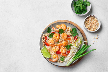 Fototapeta premium Pad Thai noodles with shrimps, prawns. Traditional thai meal.