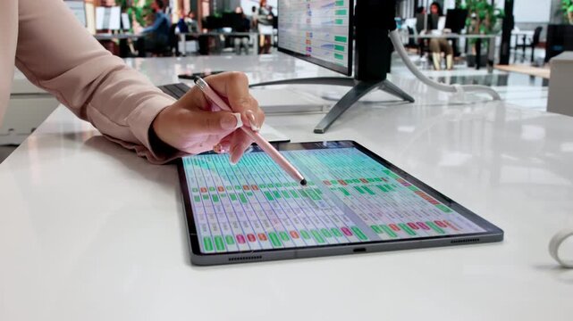 Medical Billing Coder Carefully Reviews Data On Computer