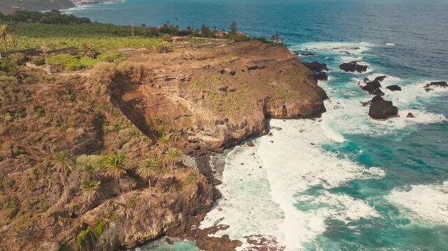 Cinematic drone views of Tenerife&rsquo;s crystal-clear waters, volcanic coastlines, golden beaches, and vibrant island summer vibes captured from above.