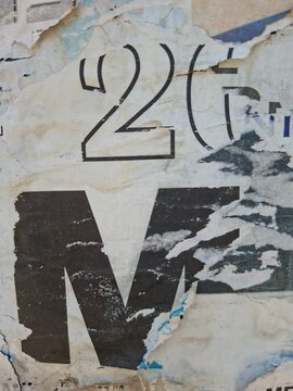 Torn and ripped street poster, grungy background, messy old paper collage