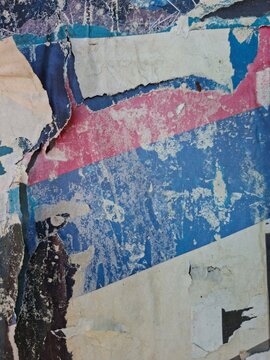 Torn and ripped street poster, grungy background, messy old paper collage