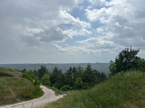 Scenic Landscape View from Bona Mountain with Dirt Path and Forest