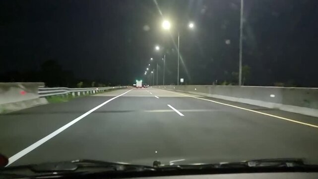 Night drive on empty highway Vehicles Driving on Solo-Yogyakarta Toll Road in Klaten Area, Central Java