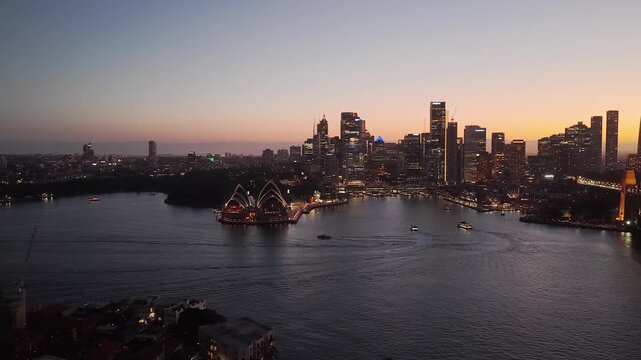 Kirribilli across harbour sunset scenic cityscape view of Sydney city waterfront by Bridge.