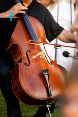 Musician performing cello at outdoor classical music concert © Alfonso Soler