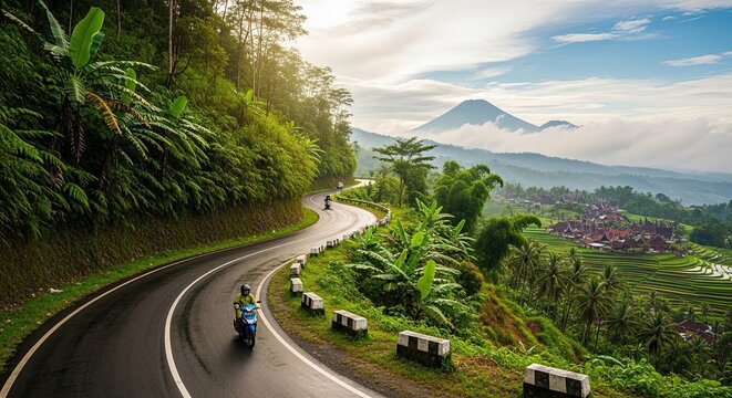 Scenic Mountain Road with Motorcyclists and Lush Greenery.