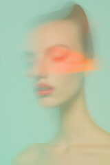 Fototapeta premium Ethereal abstract motion blur portrait of young woman with orange light streaks.