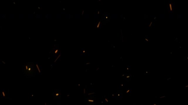 Hot Glowing Fire Sparks and Embers Rising Upwards on a Black Background.