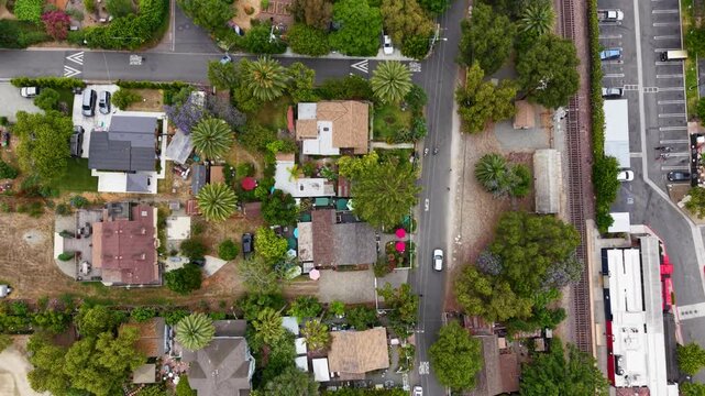 A Cinematic looking straight down shot of this beautiful small community in San Juan Capistrano California. The tree tops are mesmerizing as they slowly go by