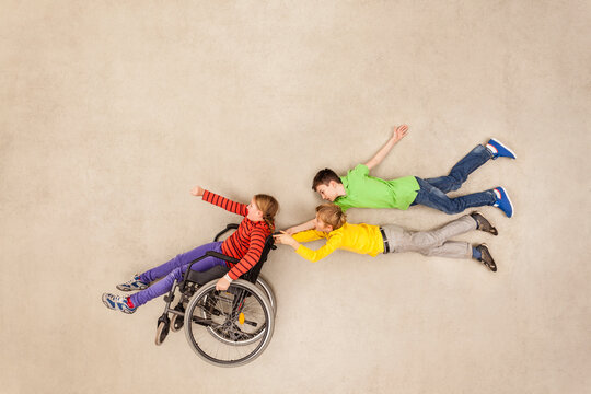 Children having fun with handicapped friend
