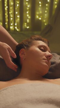 Facial Massage in Spa Salon Slow Motion, Vertical Video Cozy Warm Light Atmosphere