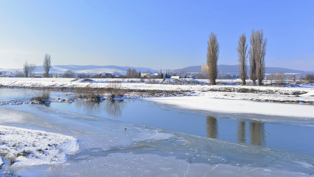 A clear but bitterly cold winter's day in Transylvania, on the banks of the River Mures.