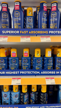 Nivea Sun sunscreen products displayed on retail store shelf in England, UK
